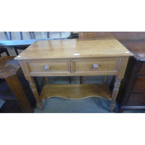 139 - A Victorian style pine two drawer kitchen serving table