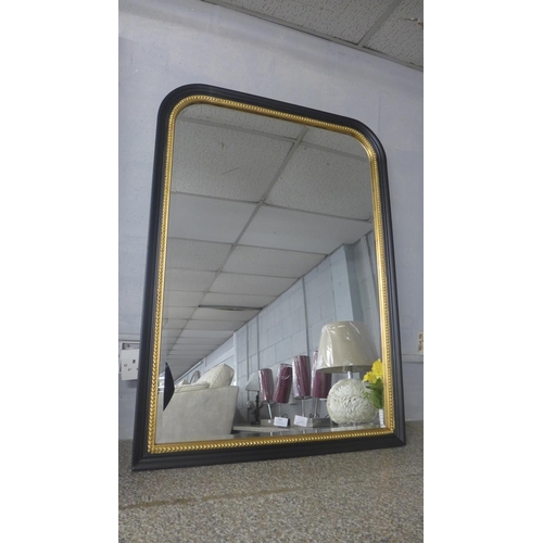 1462 - A black and gold beaded overmantel mirror