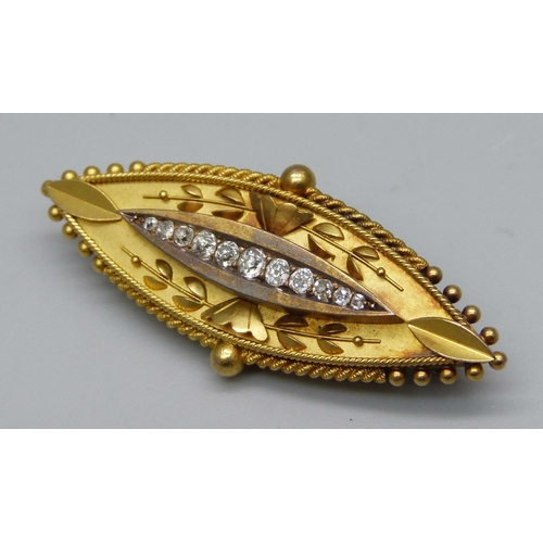 1005 - A 15ct gold brooch set with 11 diamonds, 8.1g, 4.5cm