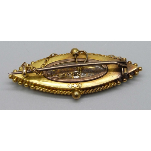 1005 - A 15ct gold brooch set with 11 diamonds, 8.1g, 4.5cm