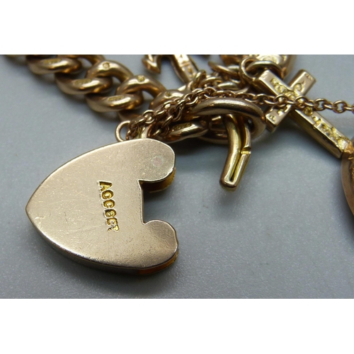 1007 - A 9ct gold curb chain bracelet, each link marked, with a faith, hope and charity charm and heart cha... 