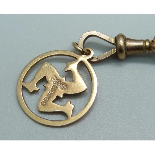 1008 - A yellow metal guard chain, one link marked 9ct, with a 9ct gold dog clip and a 9ct gold triskelion ... 