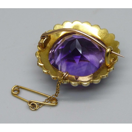 1009 - A 15ct gold brooch set with a cushion cut amethyst and seed pearl border, 11.7g, amethyst approximat... 