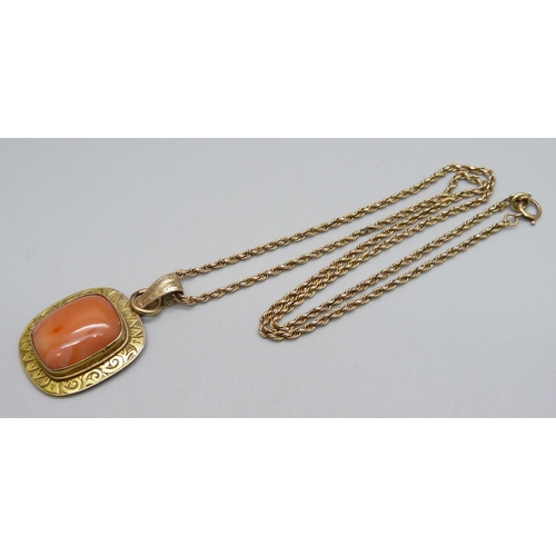 1012 - A gilt metal framed stone set pendant on a rope chain with 9ct plaque, chain 5.9g, repaired, 48cm