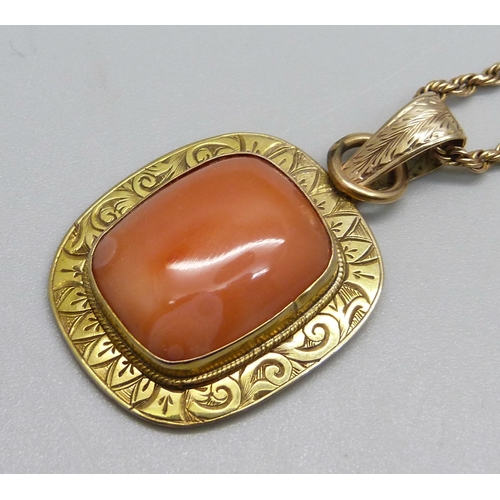 1012 - A gilt metal framed stone set pendant on a rope chain with 9ct plaque, chain 5.9g, repaired, 48cm