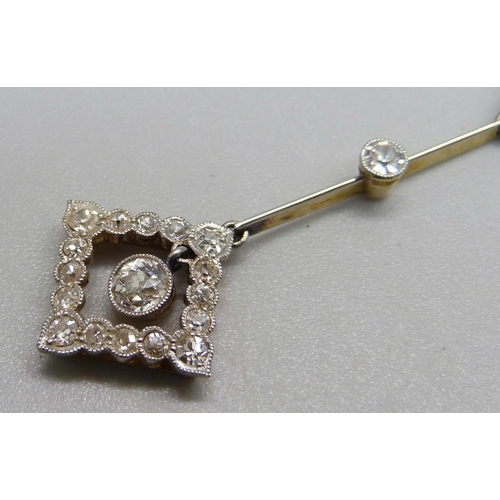 1013 - A yellow metal Art Deco pendant with platinum wash to front, set with diamonds, on a fine white meta... 