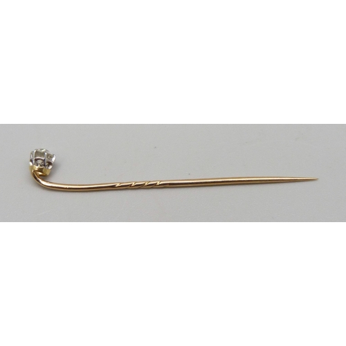 1014 - A yellow metal and diamond set stick pin, 0.9g, 5.3cm