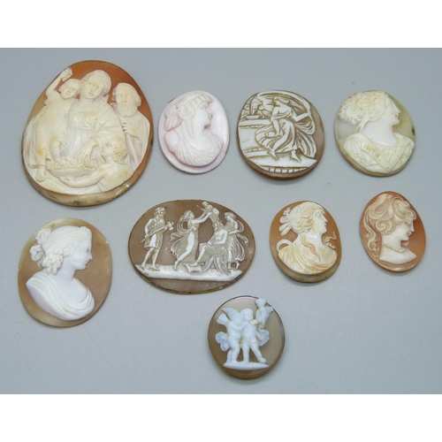 1023 - Eight carved cameos including one angel skin, largest 6cm, and a scene mounted on a gemstone depicti... 