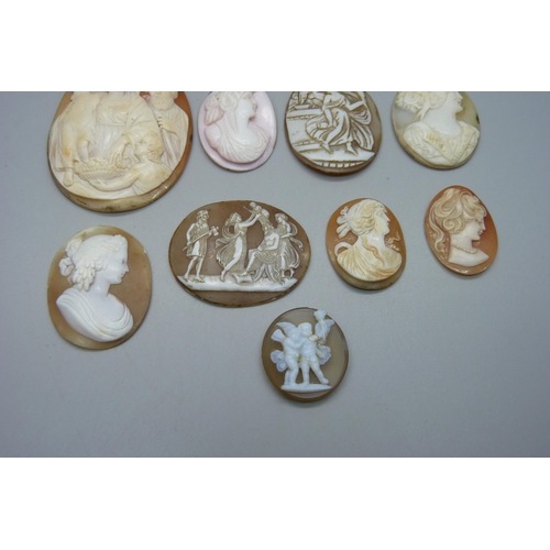 1023 - Eight carved cameos including one angel skin, largest 6cm, and a scene mounted on a gemstone depicti... 