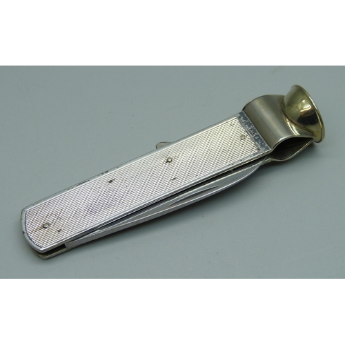 1025 - A silver cigar cutter, London, 1952, 40g