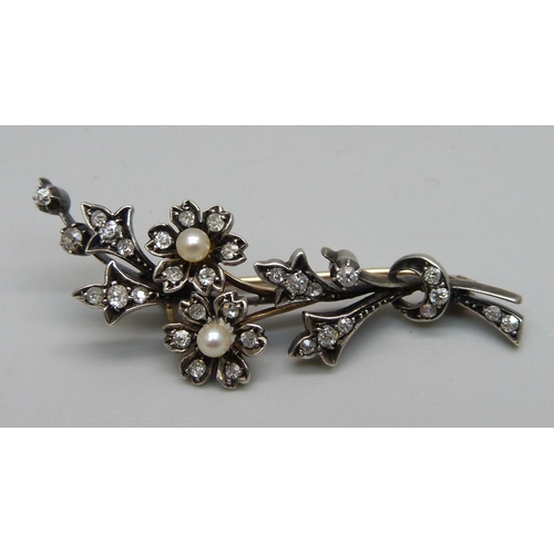 1028 - A Victorian yellow metal, diamond and pearl spray brooch, 5.6g, 4.8cm, with box