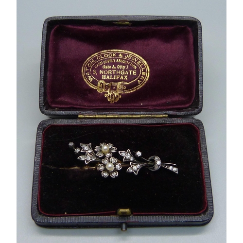 1028 - A Victorian yellow metal, diamond and pearl spray brooch, 5.6g, 4.8cm, with box