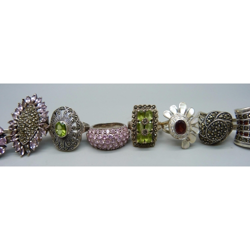 1040 - Twelve large chunky silver rings set with garnet, pearl and peridot, and one unmarked white metal ri... 