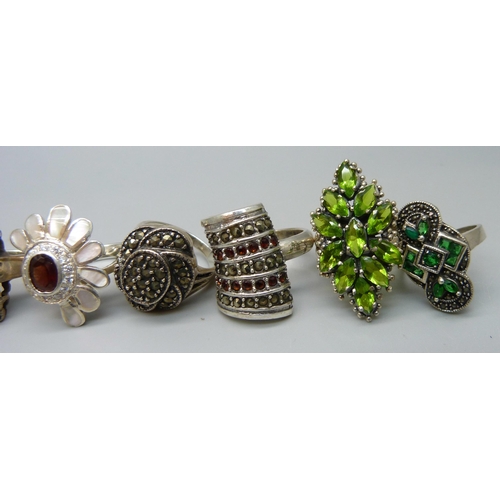 1040 - Twelve large chunky silver rings set with garnet, pearl and peridot, and one unmarked white metal ri... 