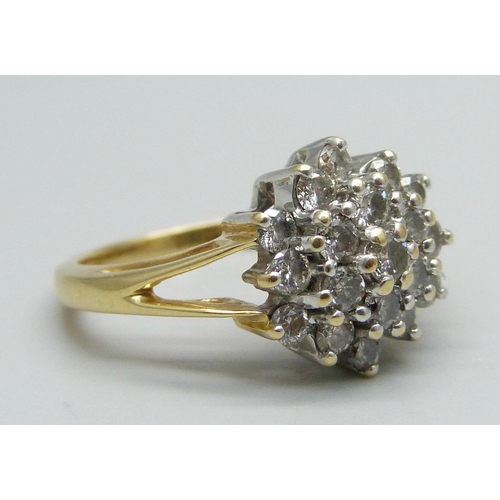 1045 - An 18ct gold and diamond cluster ring, one carat weight, 4.8g, N