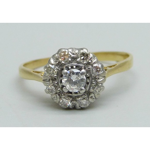 1048 - An 18ct gold and diamond cluster ring, 2.4g, N