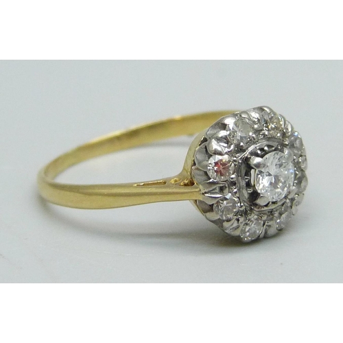 1048 - An 18ct gold and diamond cluster ring, 2.4g, N