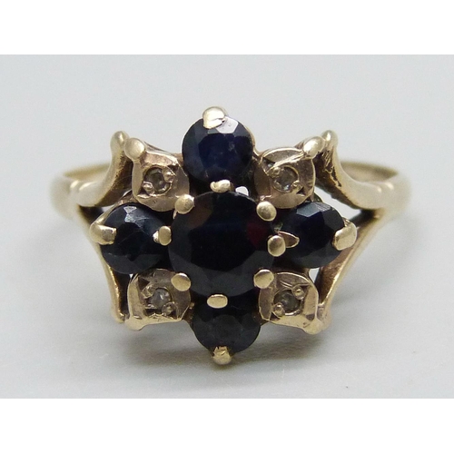 1049 - A 9ct gold, sapphire and diamond ring, one sapphire loose in setting (claw a/f), 2.9g, R