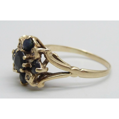 1049 - A 9ct gold, sapphire and diamond ring, one sapphire loose in setting (claw a/f), 2.9g, R