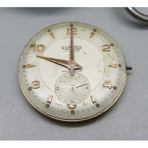 1050 - A silver pocket watch, a Roamer wristwatch movement, a gold plated watch case, and one other wristwa... 