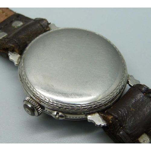 1050 - A silver pocket watch, a Roamer wristwatch movement, a gold plated watch case, and one other wristwa... 