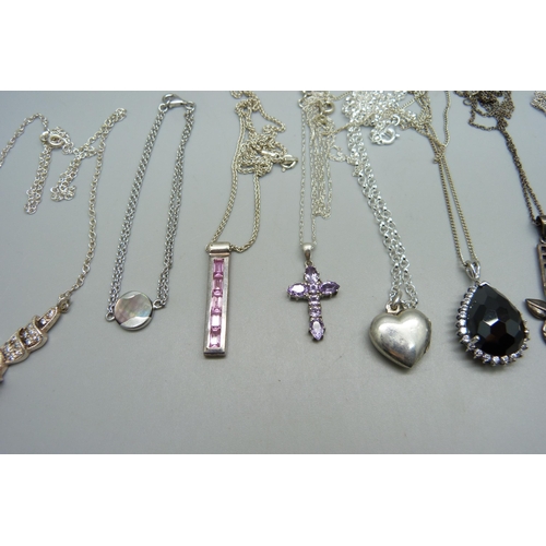 1052 - Eight sterling silver necklaces and pendants, a silver bracelet and an unmarked white metal leaf pen... 