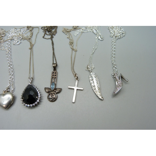 1052 - Eight sterling silver necklaces and pendants, a silver bracelet and an unmarked white metal leaf pen... 