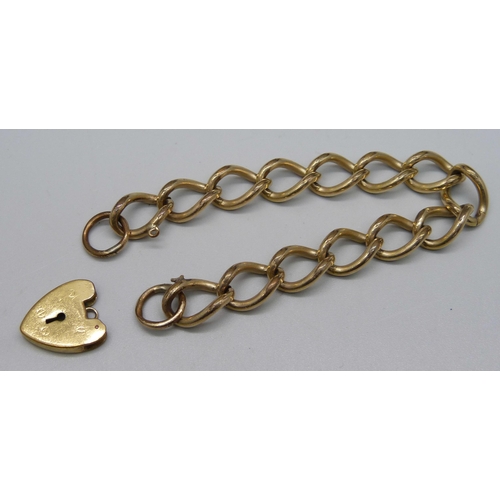 1059 - A rolled gold on metal core curb chain bracelet and padlock