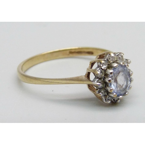 1060 - A 9ct gold cluster ring set with a light purple stone and small diamonds, 1.4g, L