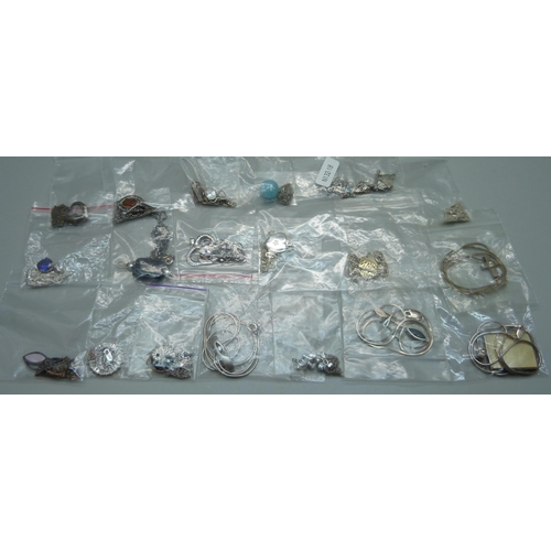 1071 - Eighteen silver pendants and chains, and two silver plated pendants on silver chains