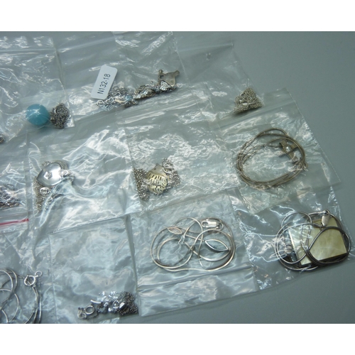 1071 - Eighteen silver pendants and chains, and two silver plated pendants on silver chains