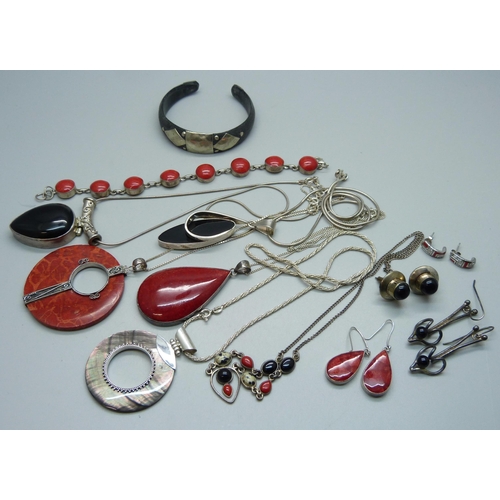 1075 - A collection of silver jewellery, many pieces set with coral including pendants, a bracelet, earring... 