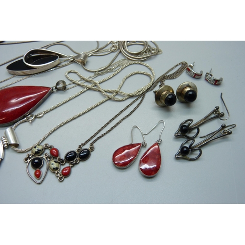 1075 - A collection of silver jewellery, many pieces set with coral including pendants, a bracelet, earring... 