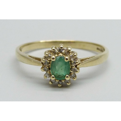 1080 - A 9ct gold, emerald and diamond cluster ring, 2.2g, U