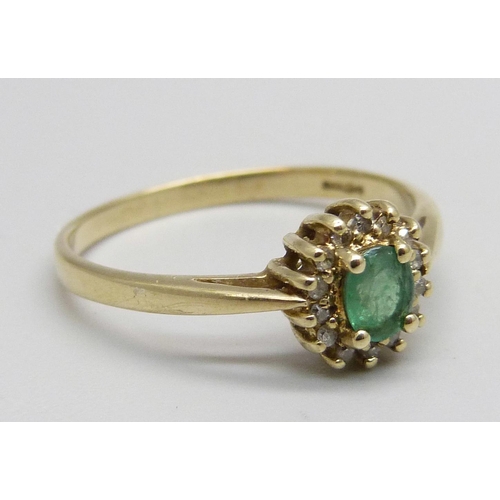 1080 - A 9ct gold, emerald and diamond cluster ring, 2.2g, U