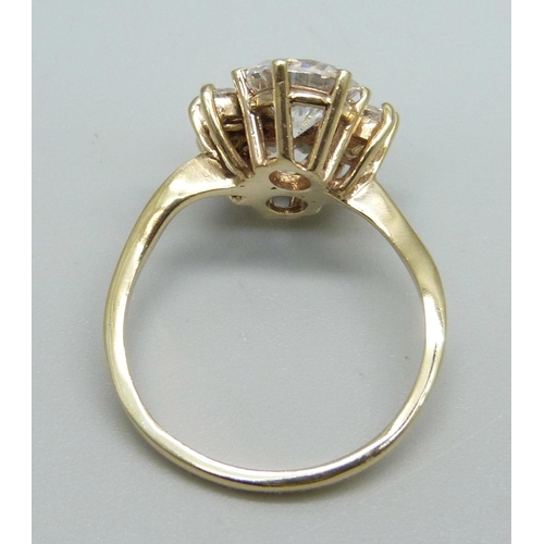 1085 - A 9ct gold and white stone cluster ring, 5.1g, U