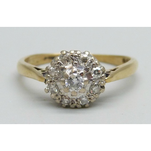 1099 - An 18ct gold diamond cluster ring, 3g, O