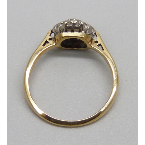 1099 - An 18ct gold diamond cluster ring, 3g, O