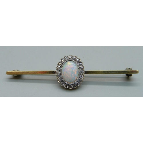 1105 - A gilt metal brooch set with a simulated opal and white stone cluster, and a pair of matching screw ... 