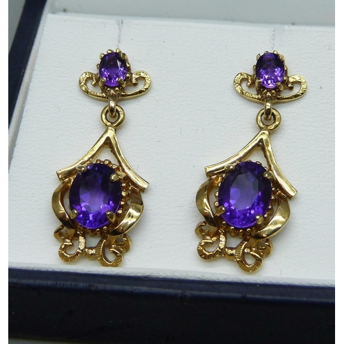 1108 - A pair of 9ct gold and amethyst set drop earrings, hallmarked on the posts, 5.9g, 3cm drop