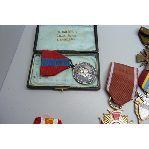 1117 - A collection of medals including a Queen Elizabeth II For Faithful Service Medal to Walter Stanley R... 