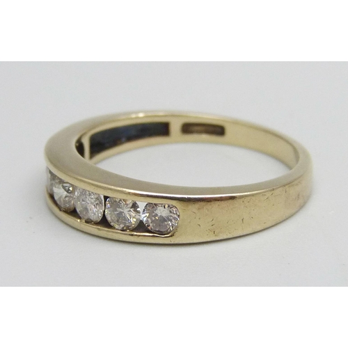 1121 - A 9ct gold, seven stone diamond half eternity ring, shank stamped 0.75ct, 3g, R