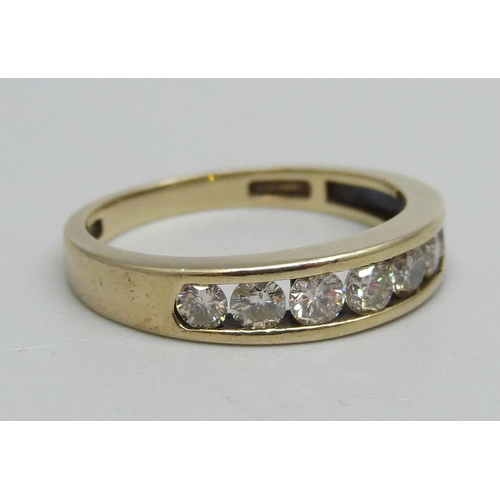 1121 - A 9ct gold, seven stone diamond half eternity ring, shank stamped 0.75ct, 3g, R