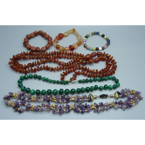 1128 - Hardstone necklets and bracelets including malachite, carnelian, etc.