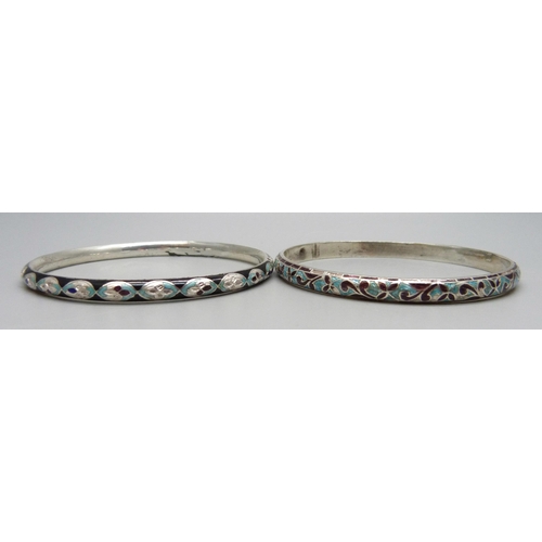 1132 - Two white metal and enamelled bangles, enamel a/f, tests as silver, 27g