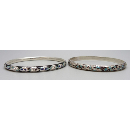 1132 - Two white metal and enamelled bangles, enamel a/f, tests as silver, 27g