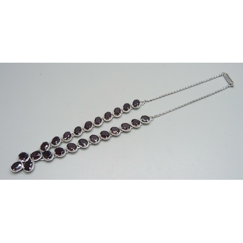 1133 - A silver and garnet set neck chain, 26g, approximately 42cm