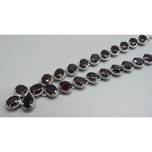 1133 - A silver and garnet set neck chain, 26g, approximately 42cm