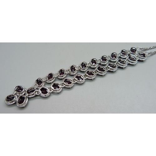 1133 - A silver and garnet set neck chain, 26g, approximately 42cm