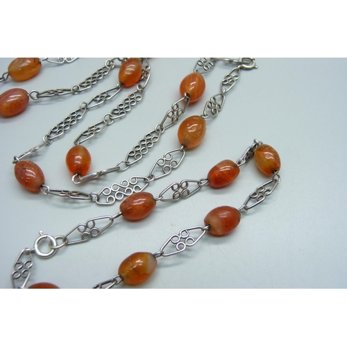 1139 - A silver and carnelian neck chain and bracelet, total weight 43g, bracelet 23cm, necklace approximat... 